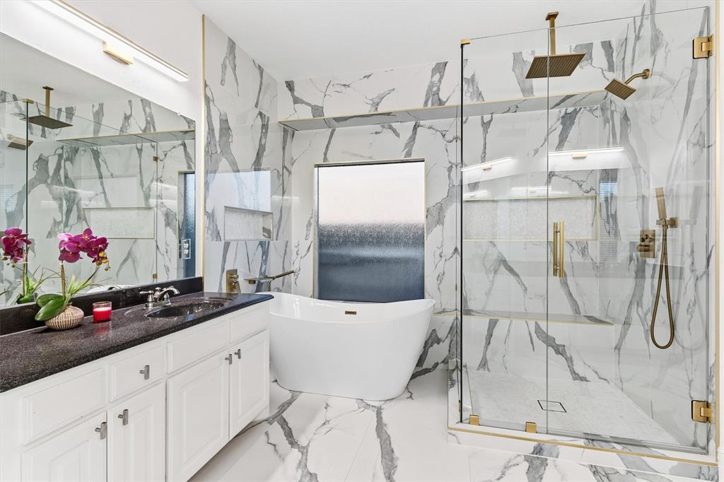 810 Summerfield Prosper, TX 75078 - Photo 3 of 19 a bathroom with a granite countertop shower sink and cabinets