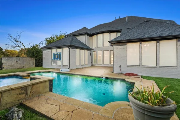 a front view of a house with swimming pool