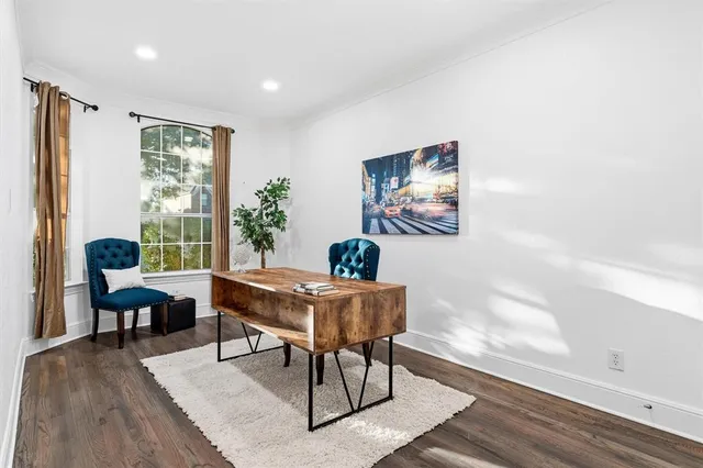 a work room with furniture and wooden floor
