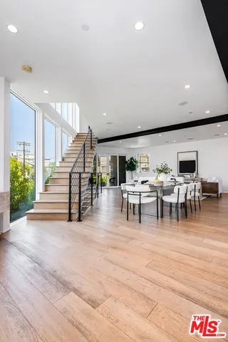 a living room with lots of furniture and a table