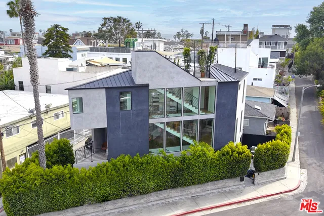 a aerial view of a house with a garden and plants