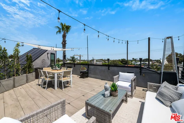 a view of a terrace with furniture