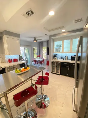 a kitchen with stainless steel appliances kitchen island granite countertop a sink and cabinets