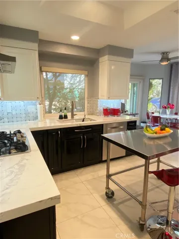 a view of a kitchen with furniture and a window