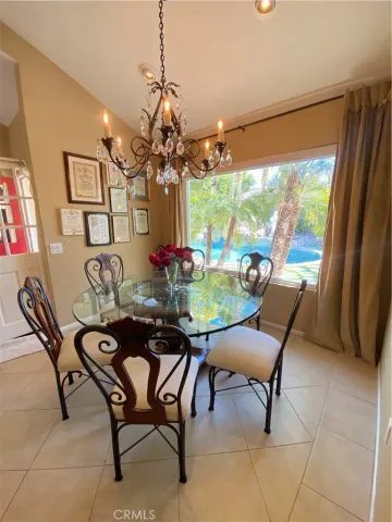 a view of a backyard with plants and outdoor seating