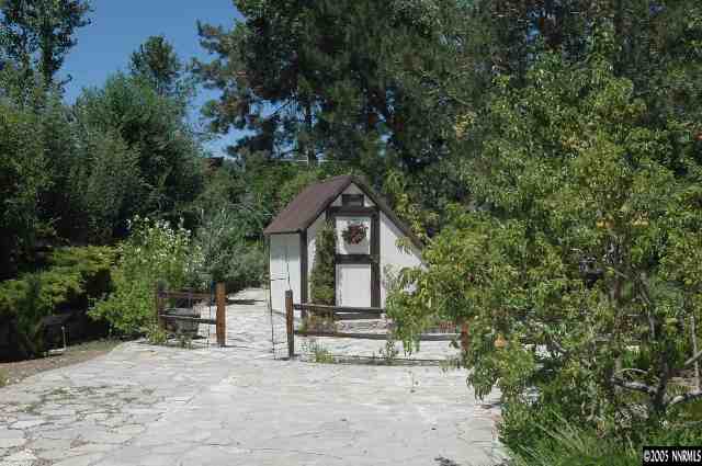 1820 Wendy Way Reno, NV 89509 - Photo 3 of 8 a house with trees in the background