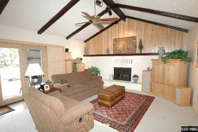 1820 Wendy Way Reno, NV 89509 - Photo 4 of 8 a living room with furniture a fireplace and a table