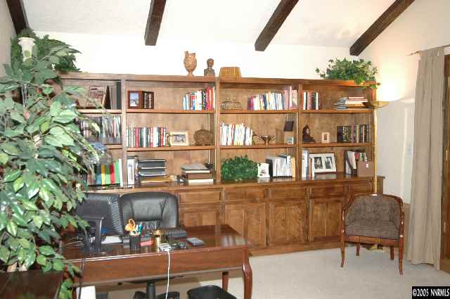 1820 Wendy Way Reno, NV 89509 - Photo 5 of 8 a view of a workspace with a bookshelf
