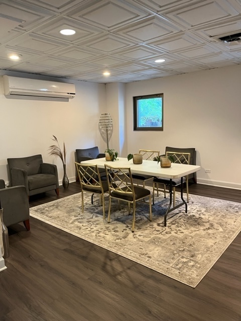 253 East Delaware Place, Unit 16E Chicago, IL 60611 - Photo 2 of 13 a view of a dining room with furniture and wooden floor
