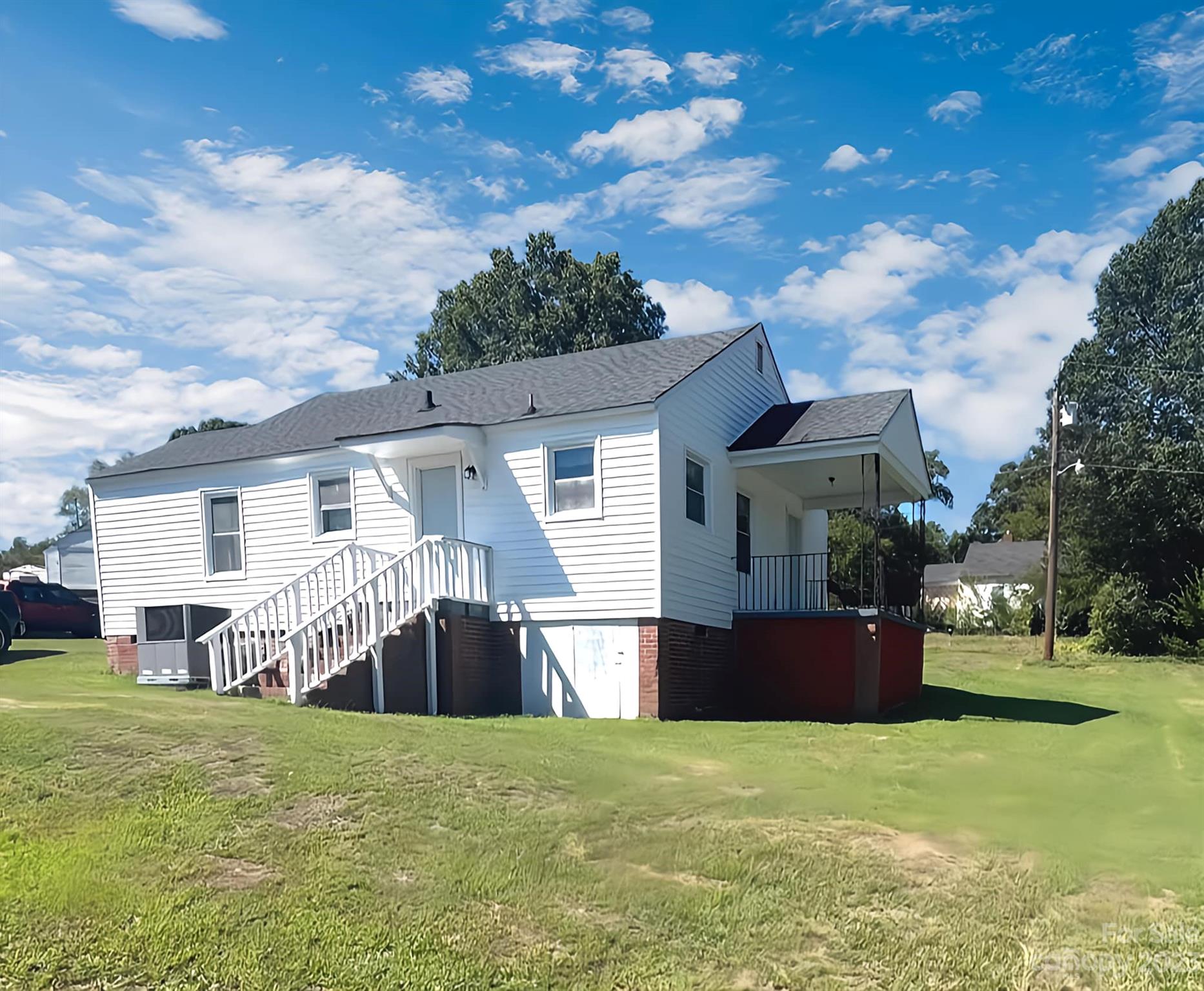 556 6th Street Chester, SC 29706 - Photo 2 of 10 a front view of house with yard and trees in the background