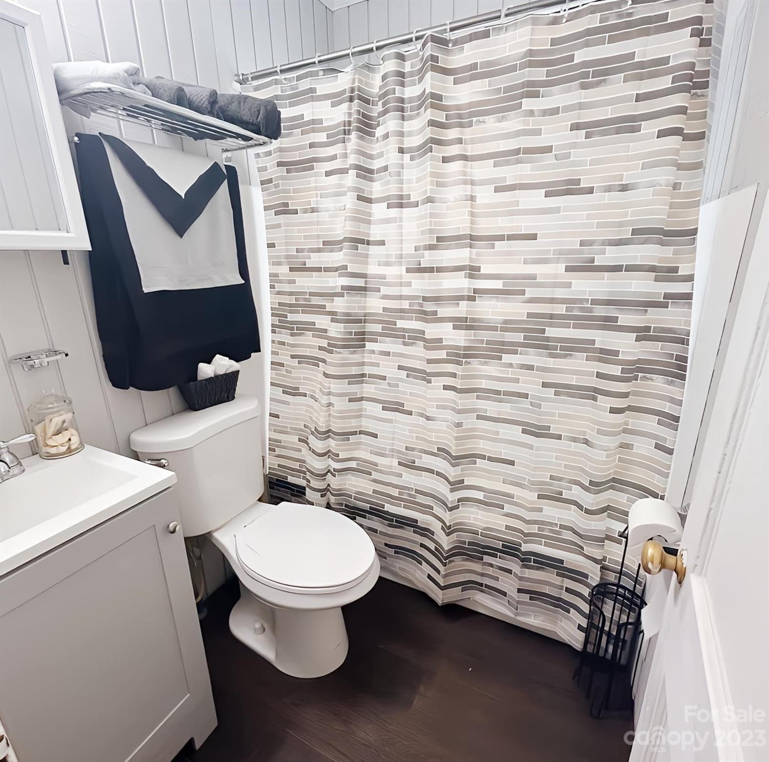 556 6th Street Chester, SC 29706 - Photo 8 of 10 a bathroom with a toilet and a shower curtain