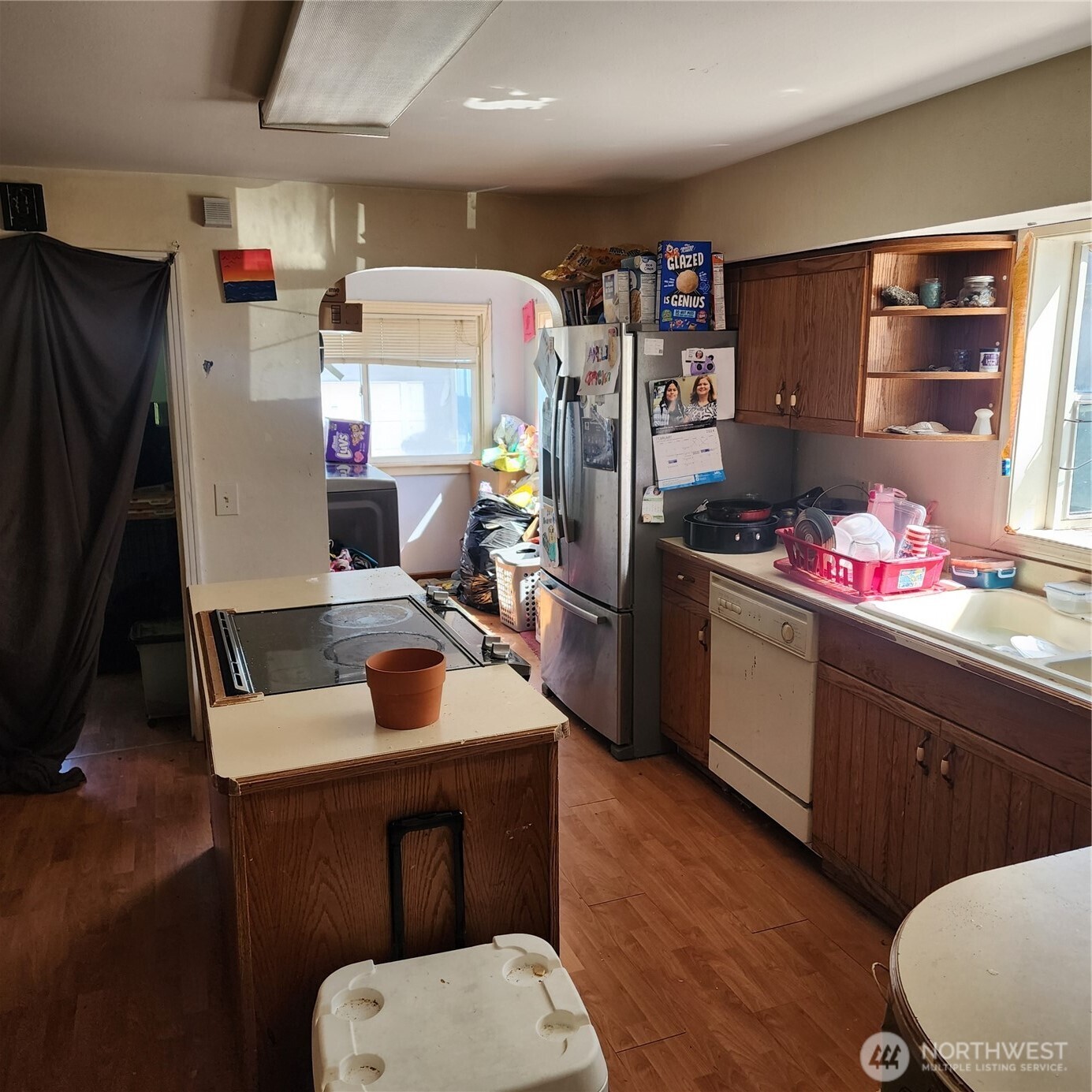 818 8th Avenue Longview, WA 98632 - Photo 27 of 28 a kitchen with stainless steel appliances a sink cabinets and wooden floor