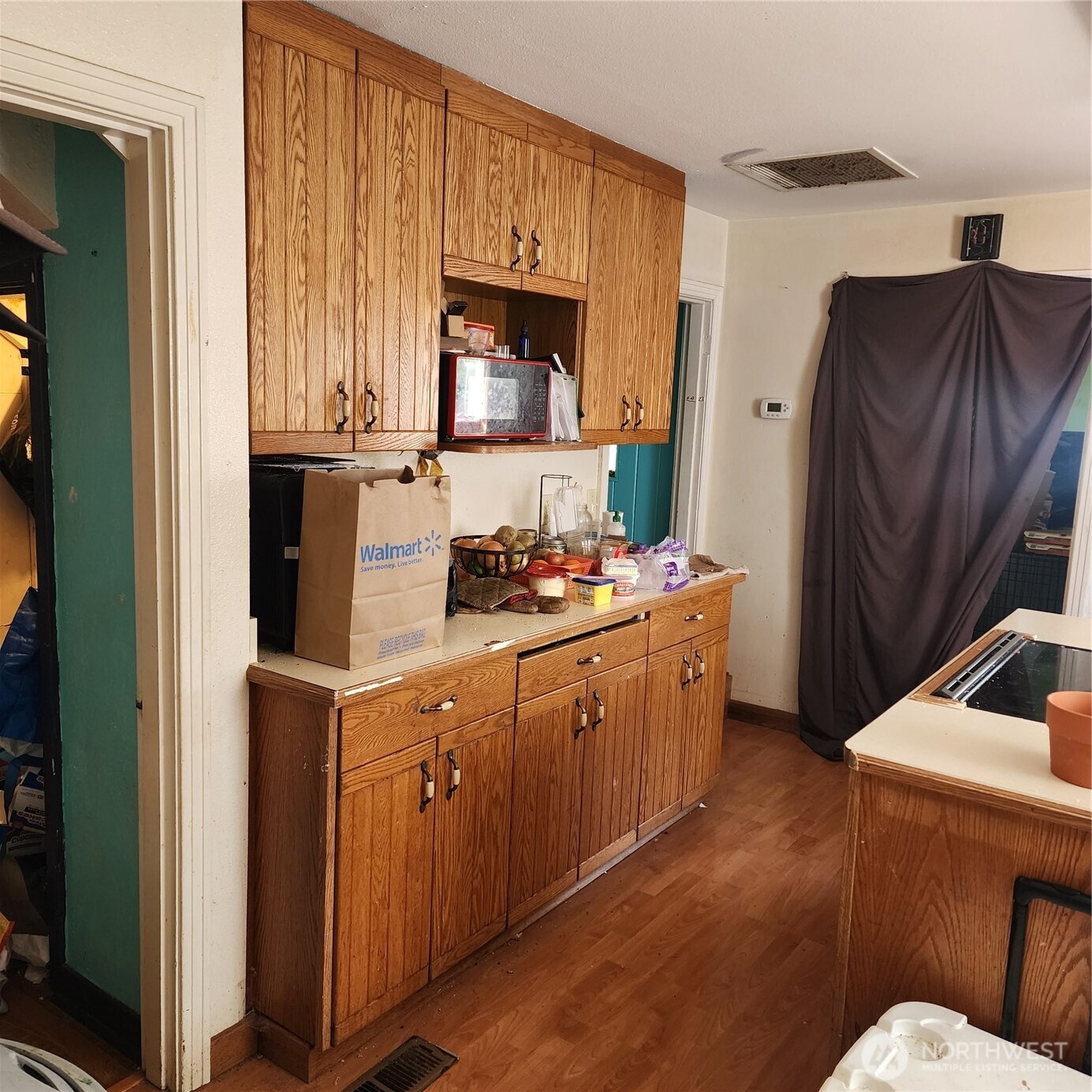 818 8th Avenue Longview, WA 98632 - Photo 28 of 28 a kitchen with stainless steel appliances granite countertop a refrigerator a stove and a sink with wooden floor