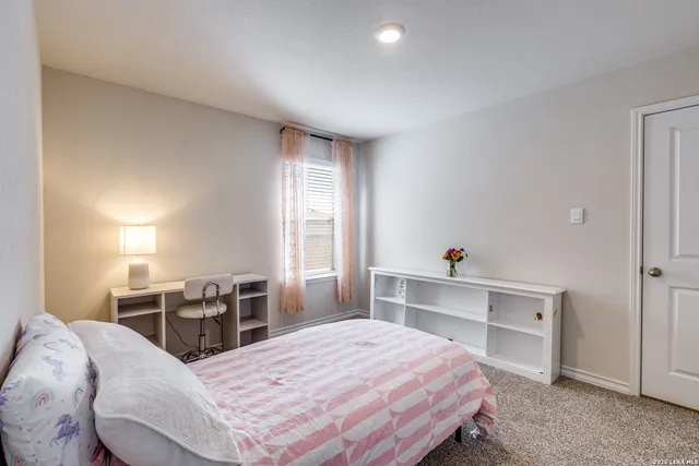 a bed room with a bed and a desk