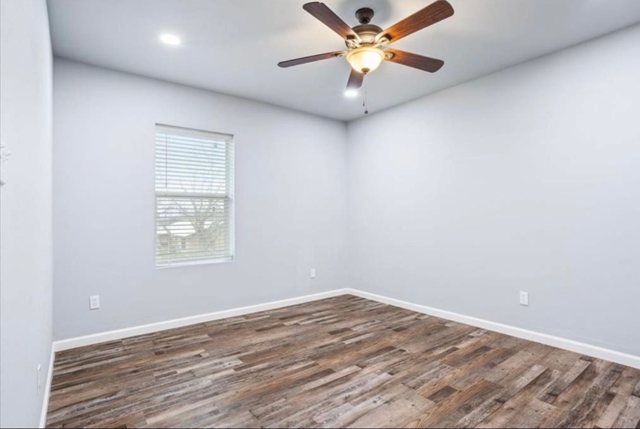 117 Emma Street, Unit B Bartlett, TX 76511 - Photo 12 of 18 an empty room with a window and a fan