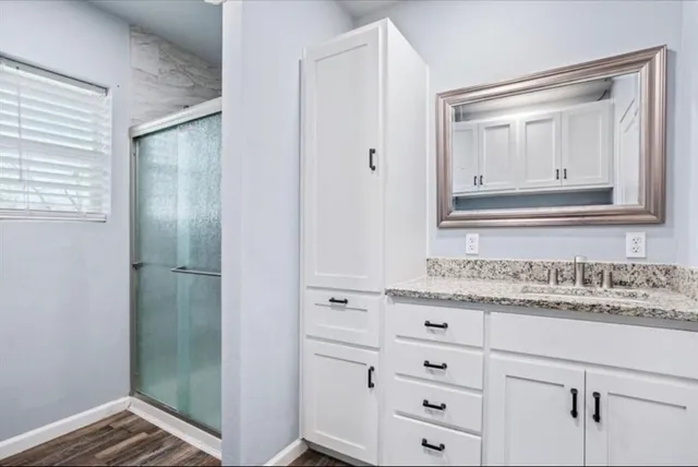 a bathroom with a sink and a mirror