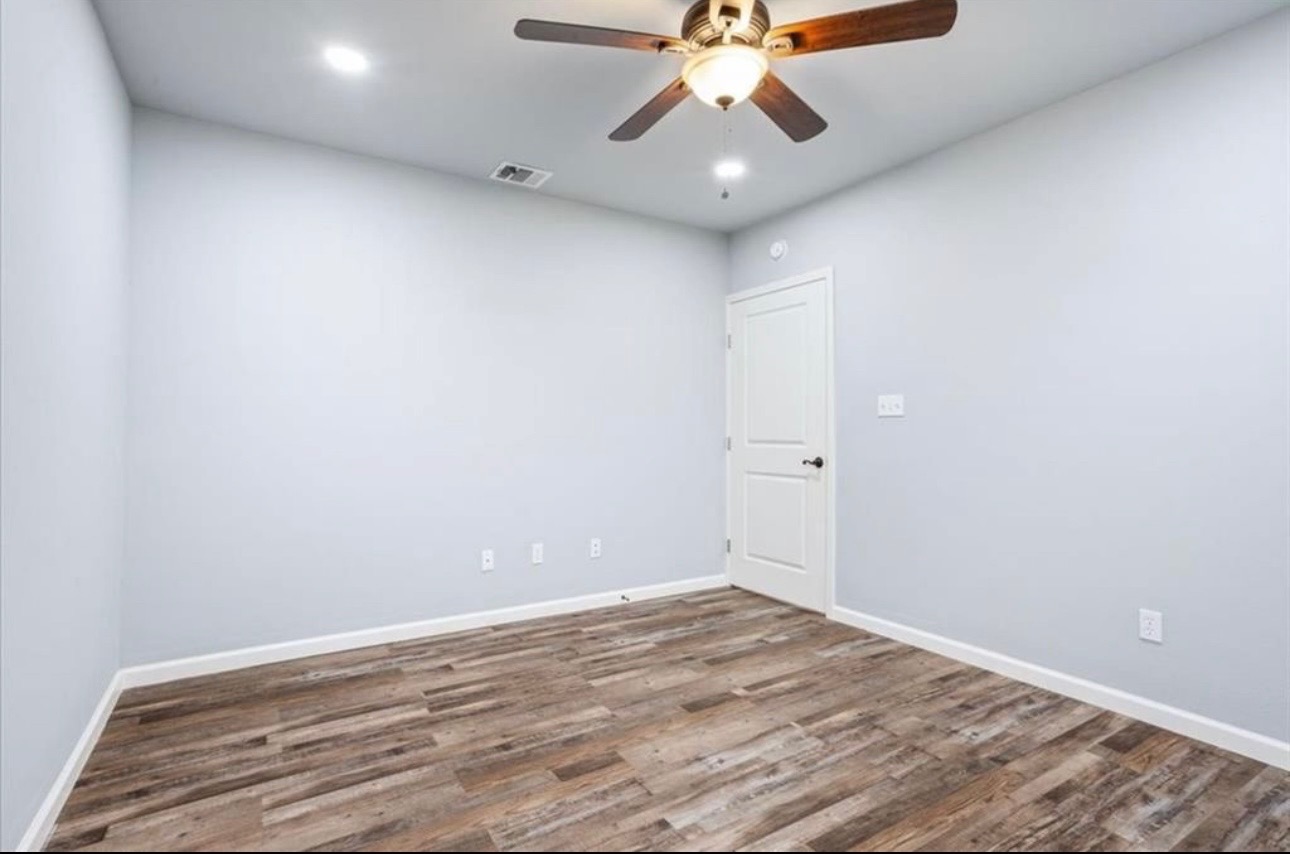 117 Emma Street, Unit B Bartlett, TX 76511 - Photo 16 of 18 wooden floor in an empty room