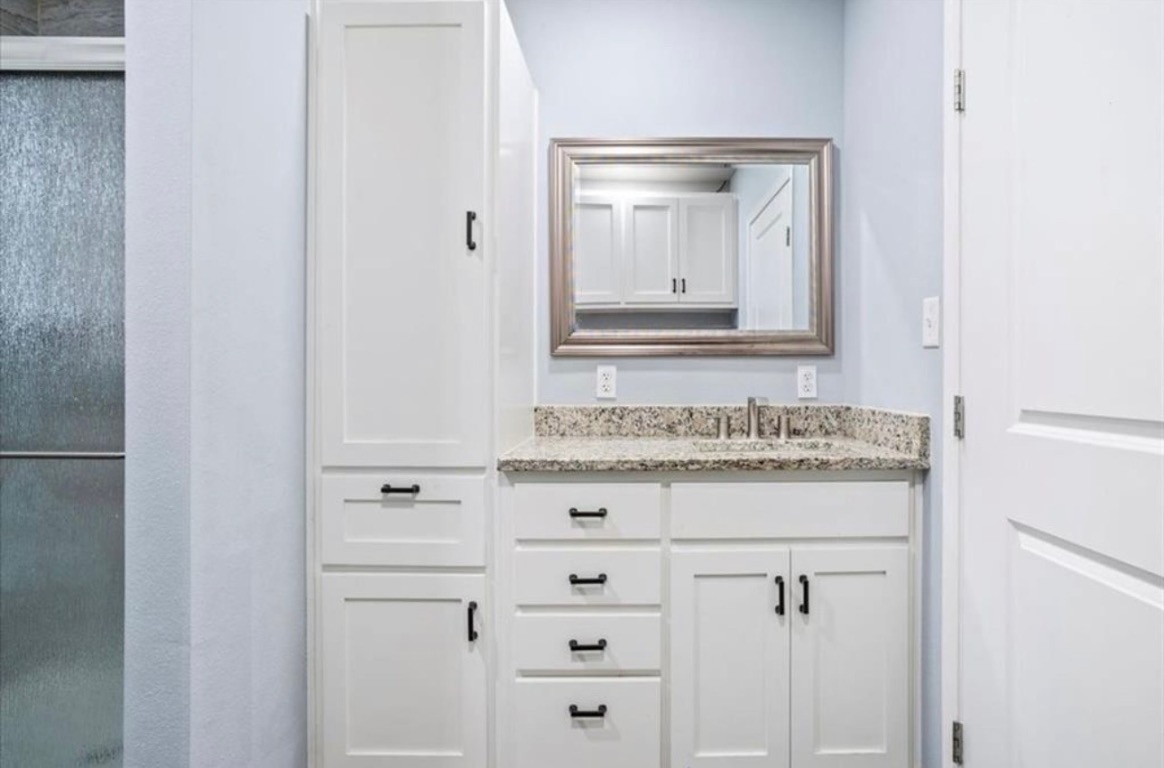 117 Emma Street, Unit B Bartlett, TX 76511 - Photo 10 of 18 a bathroom with a sink and a mirror