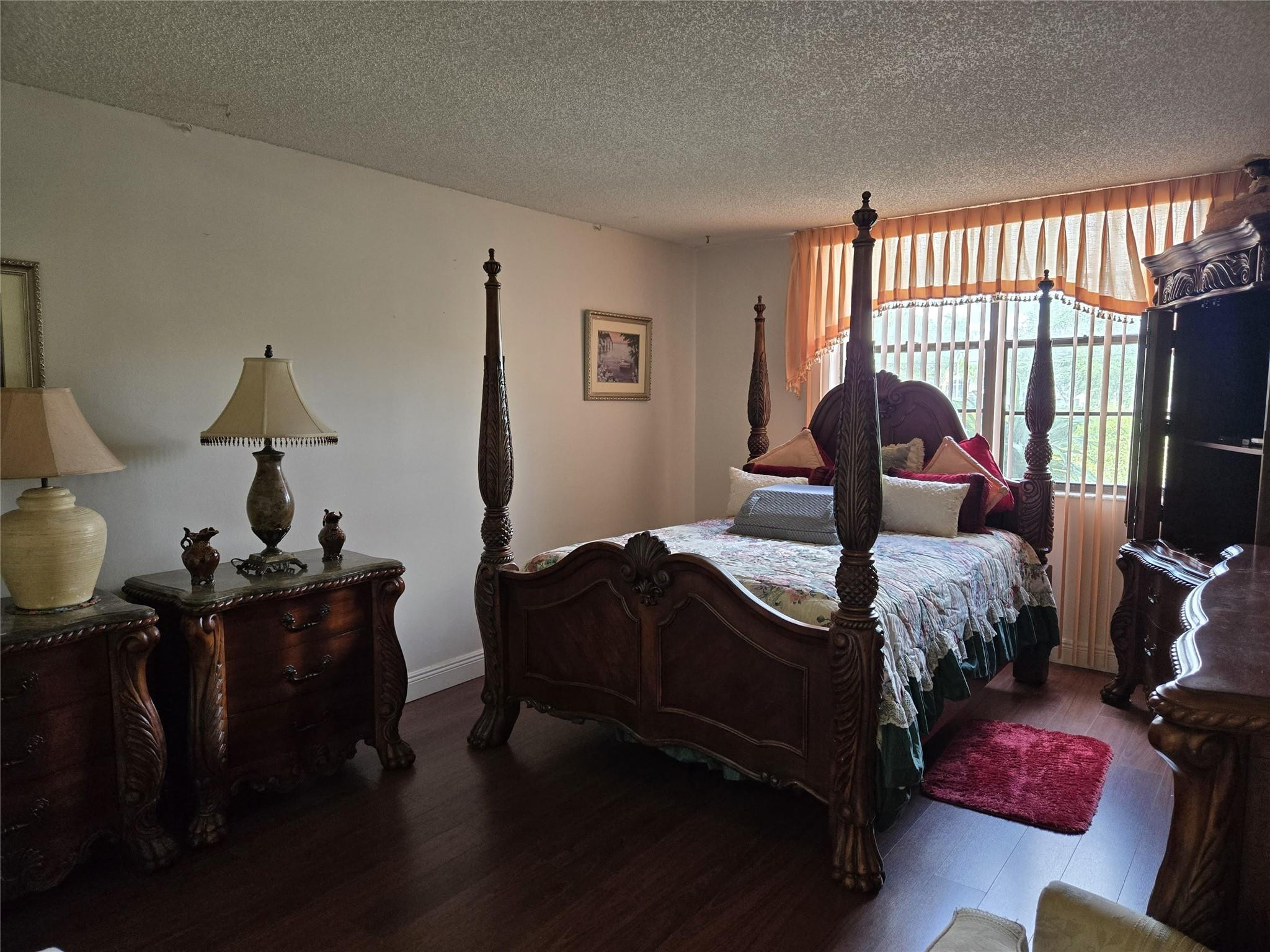 6195 Rock Island Road, Unit 215 Tamarac, FL 33319 - Photo 24 of 37 a bedroom with bed and a window