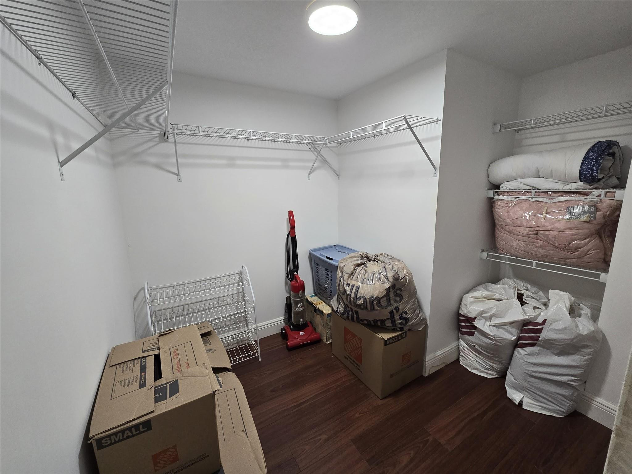 6195 Rock Island Road, Unit 215 Tamarac, FL 33319 - Photo 28 of 37 a bedroom with furniture and a wooden floor