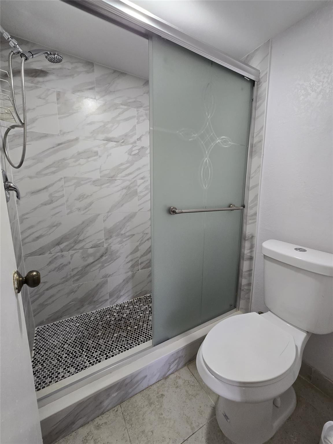 6195 Rock Island Road, Unit 215 Tamarac, FL 33319 - Photo 29 of 37 a bathroom with a toilet and a shower
