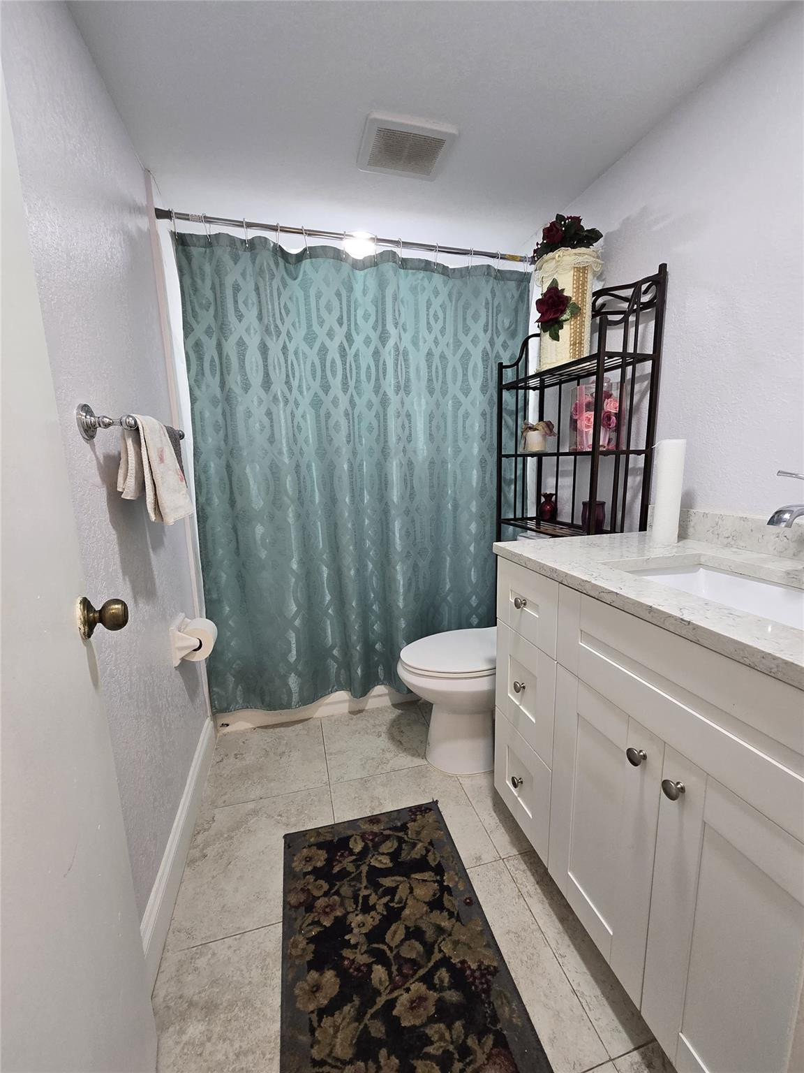 6195 Rock Island Road, Unit 215 Tamarac, FL 33319 - Photo 34 of 37 a bathroom with a sink toilet and shower