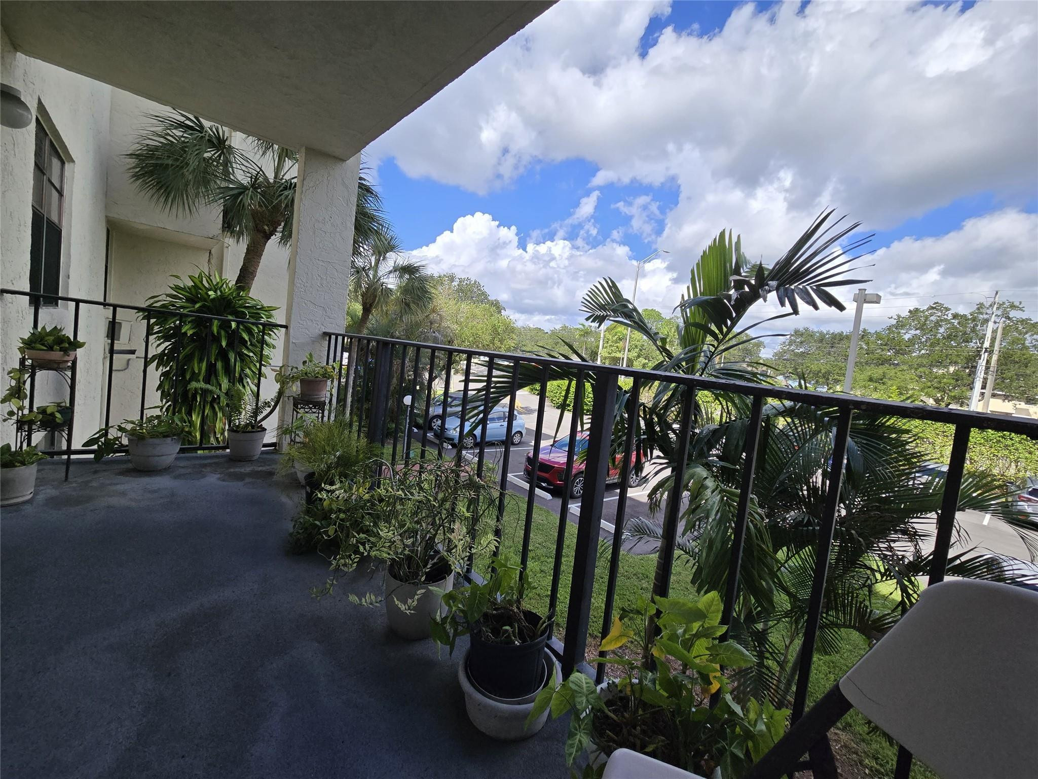 6195 Rock Island Road, Unit 215 Tamarac, FL 33319 - Photo 36 of 37 a view of a potted flower in a garden