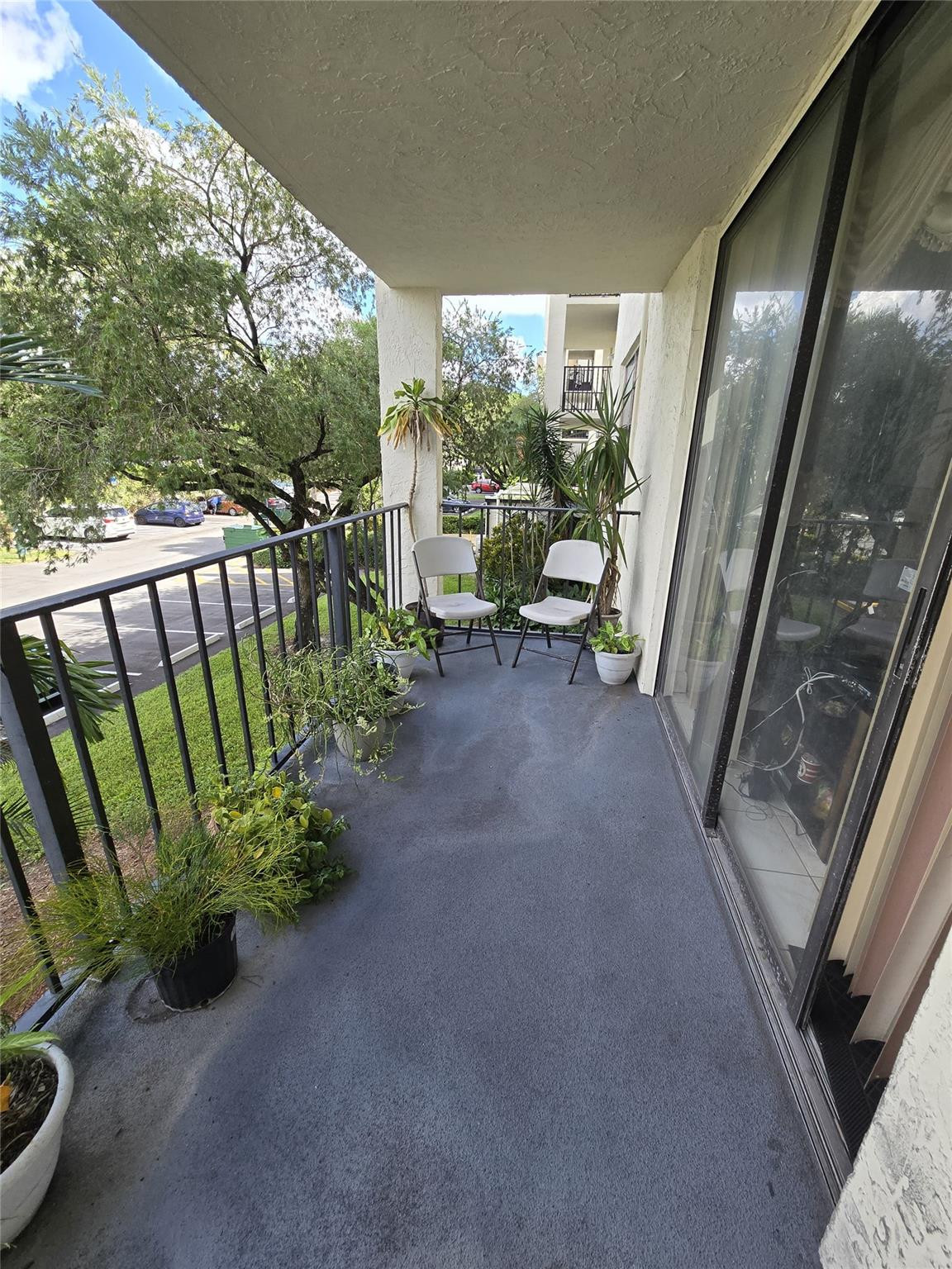 6195 Rock Island Road, Unit 215 Tamarac, FL 33319 - Photo 37 of 37 a view of a porch with furniture