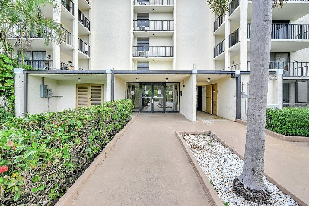 6195 Rock Island Road, Unit 215 Tamarac, FL 33319 - Photo 7 of 37 front view of a brick building