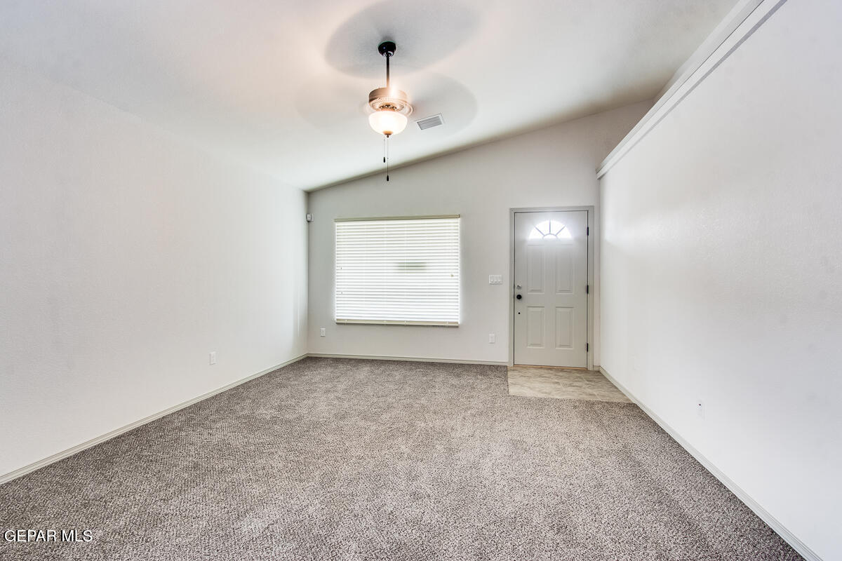 12420 Oconee Place Clint, TX 79836 - Photo 8 of 27 an empty room with windows