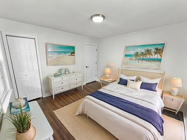 a bedroom with a bed and a couch