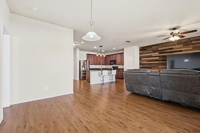 a view of kitchen and kitchen with furniture wooden floor and window