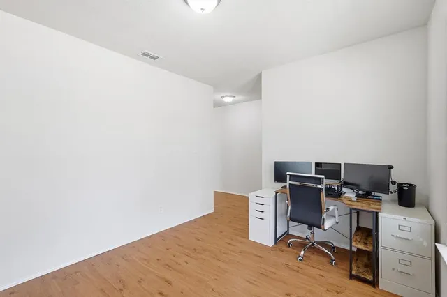 a view of a workspace with furniture