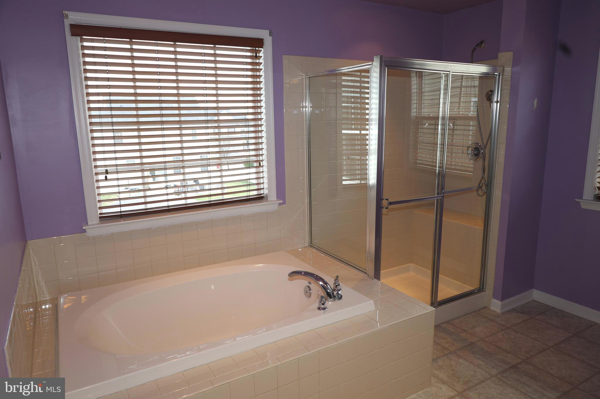 1224 North Fairfax Boulevard Ranson, WV 25438 - Photo 22 of 38 a bathroom with a bathtub and a shower