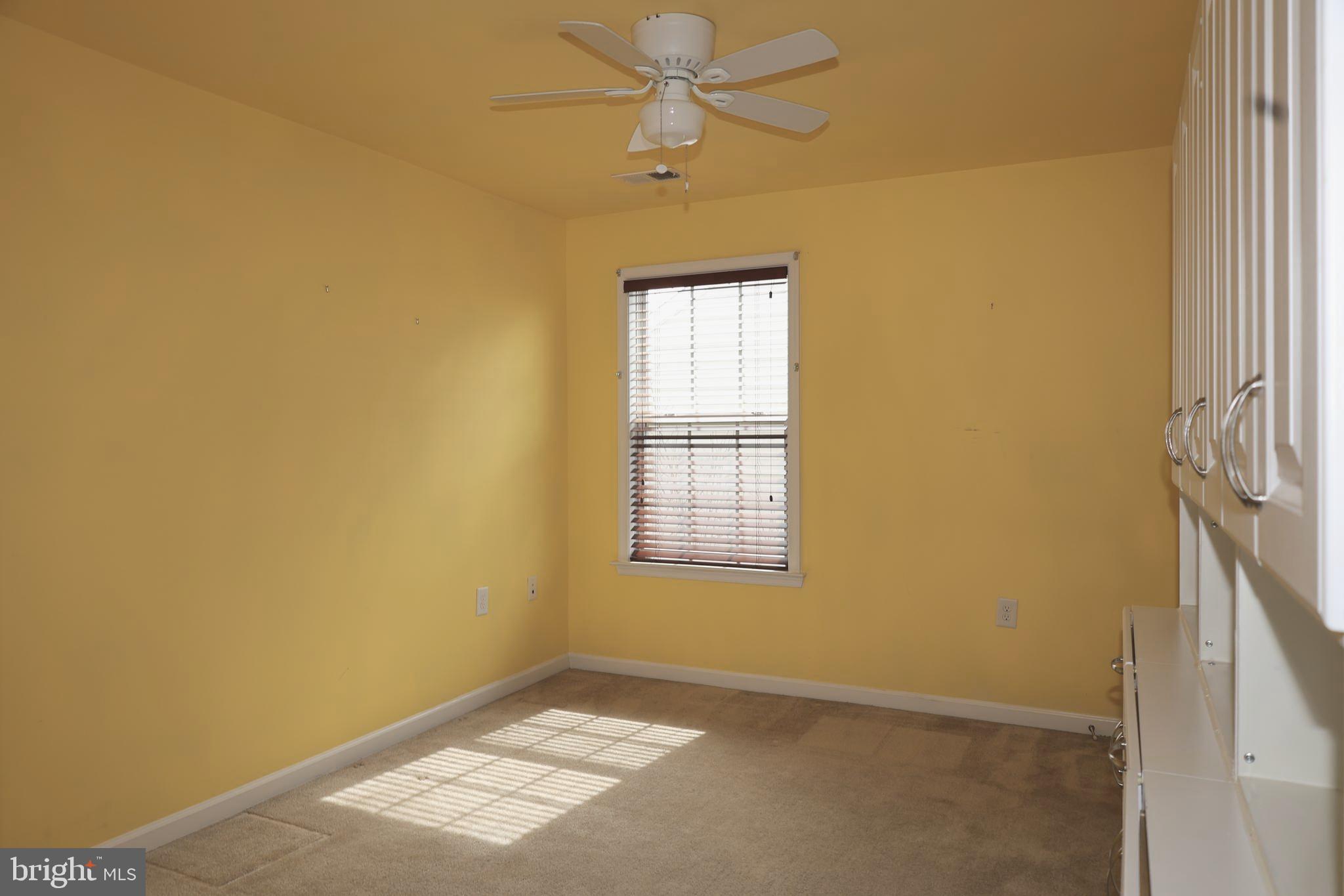 1224 North Fairfax Boulevard Ranson, WV 25438 - Photo 25 of 38 an empty room with windows and fan