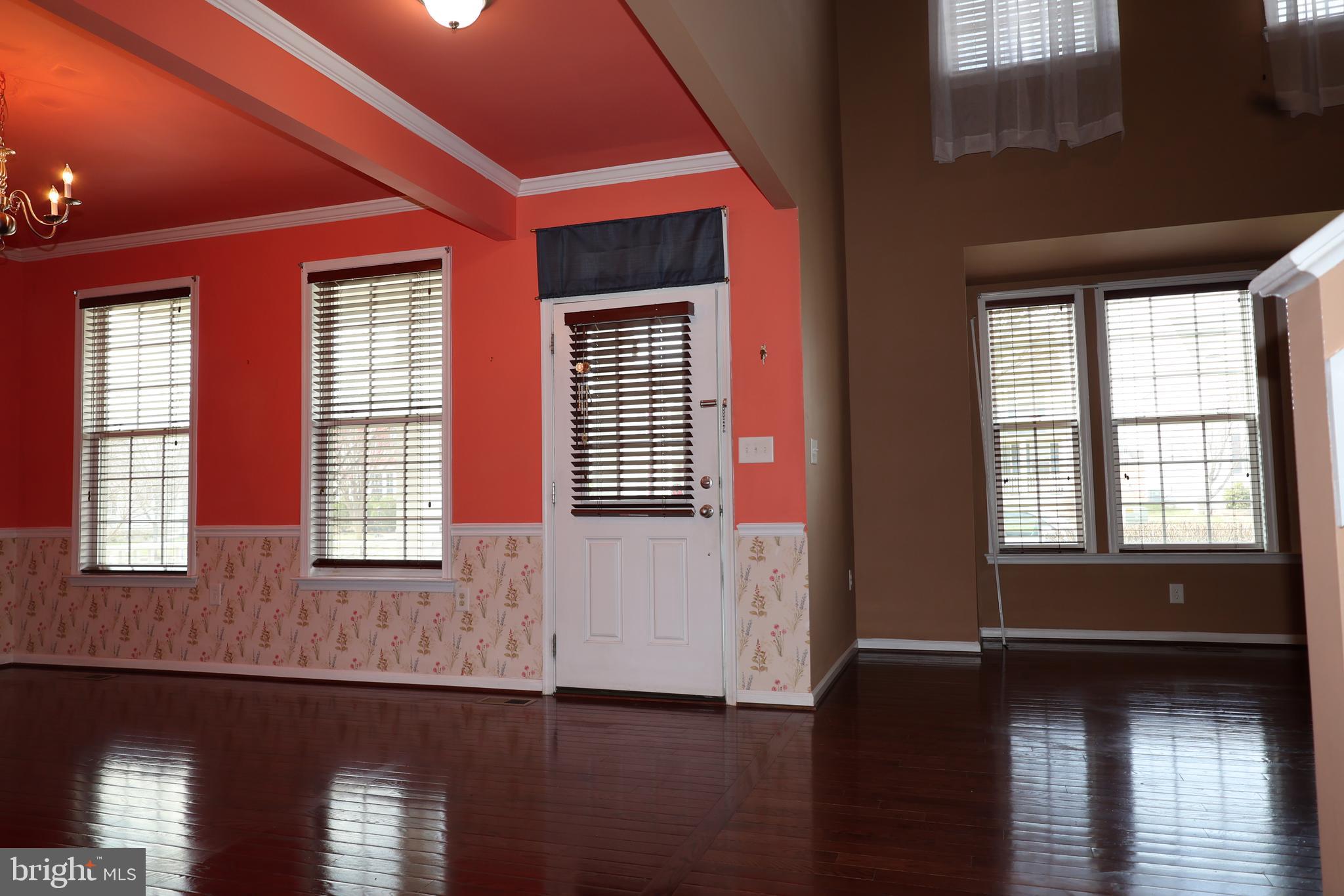 1224 North Fairfax Boulevard Ranson, WV 25438 - Photo 8 of 38 a view of an empty room with wooden floor and a window