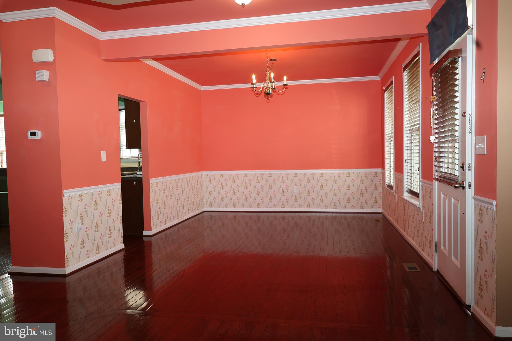 1224 North Fairfax Boulevard Ranson, WV 25438 - Photo 9 of 38 wooden floor in an empty room with a window