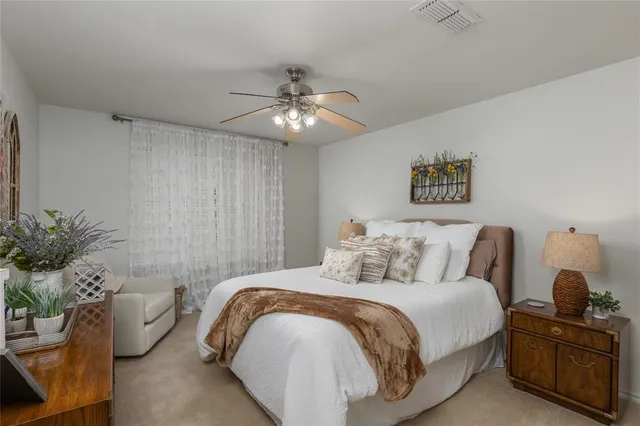 a view of a house with backyard sitting area and garden