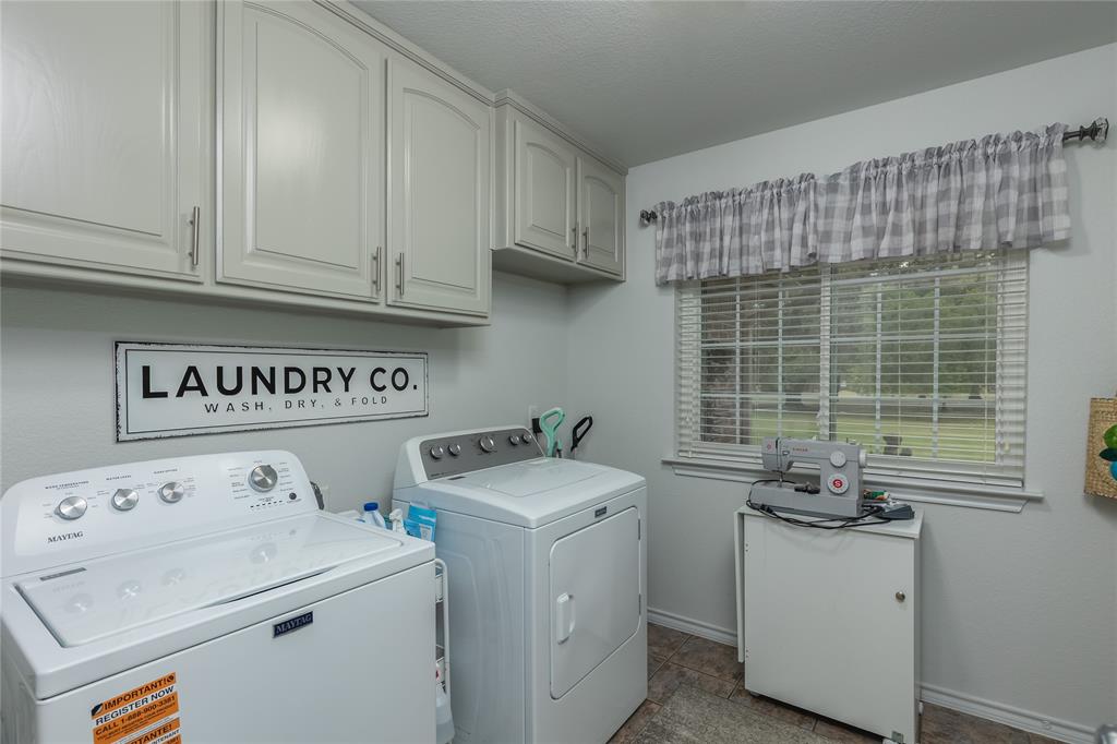 510 Highland Road Springtown, TX 76082 - Photo 25 of 40 a utility room with dryer and washer