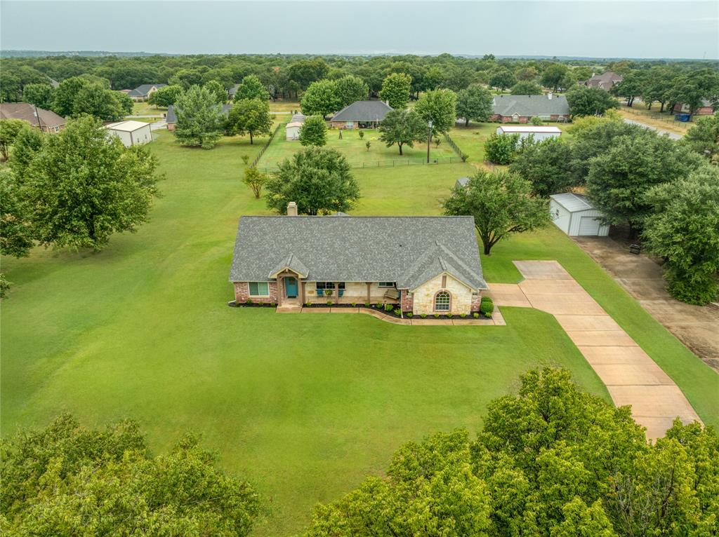 510 Highland Road Springtown, TX 76082 - Photo 26 of 40 a view of a lake with a yard