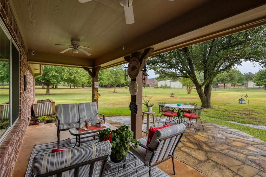 510 Highland Road Springtown, TX 76082 - Photo 27 of 40 a view of a patio with swimming pool table and chairs