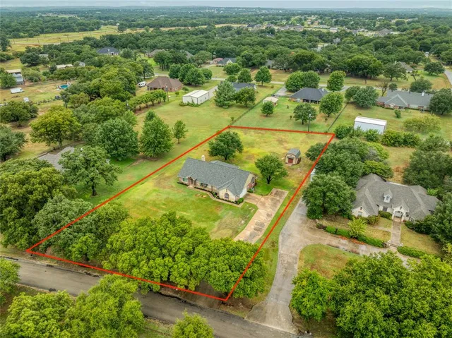 a front view of a house with a big yard