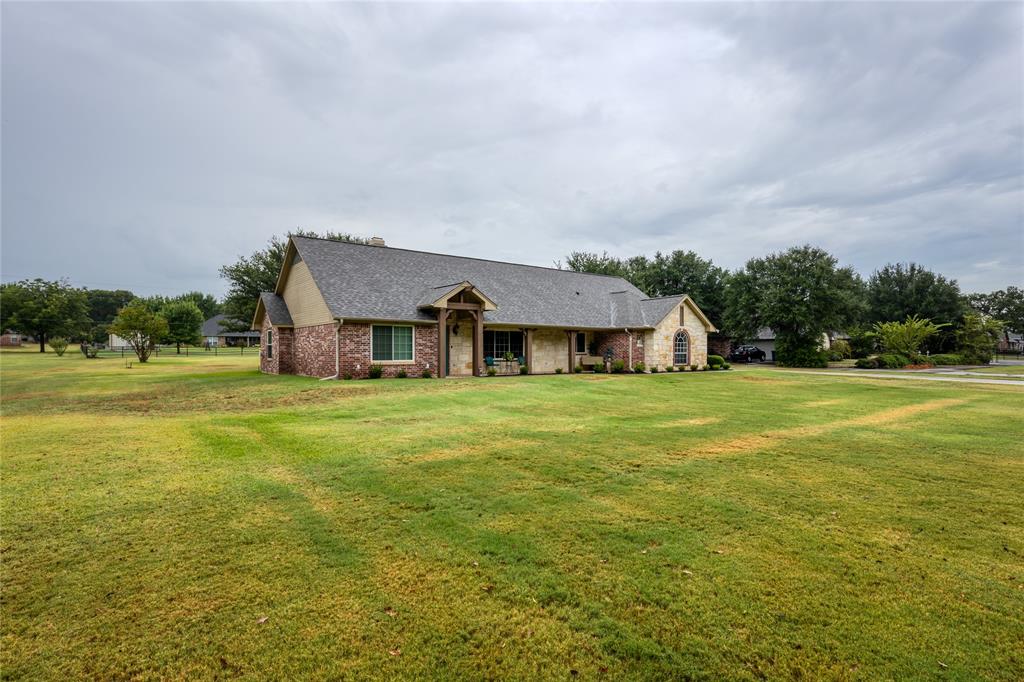510 Highland Road Springtown, TX 76082 - Photo 39 of 40 a front view of a house with a big yard