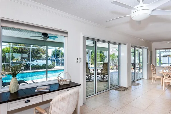a room with furniture and large windows