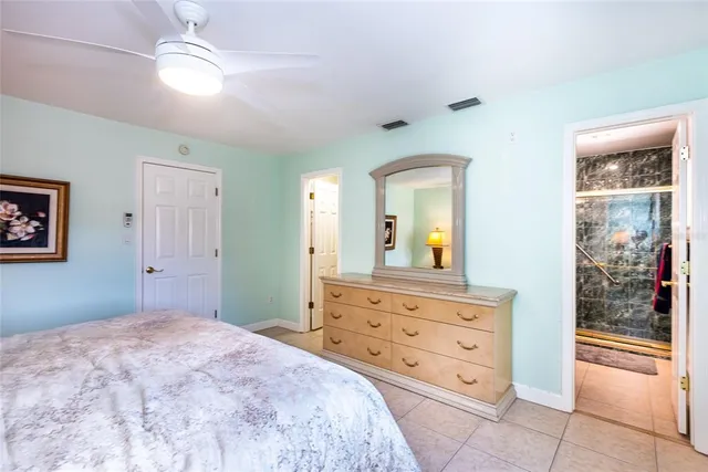 a bedroom with a bed and a dresser