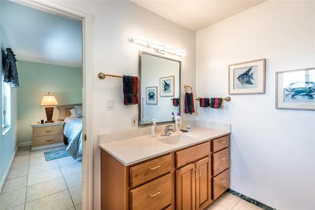 a spacious bathroom with a sink double vanity and a mirror