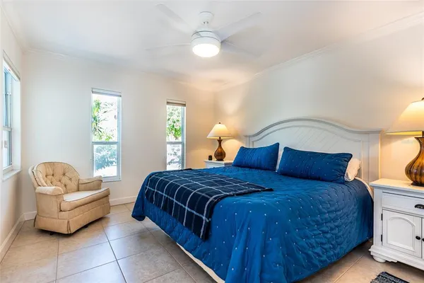 a bedroom with a bed and a couch