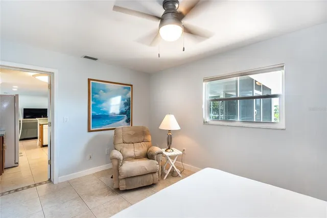 a bedroom with furniture and a window
