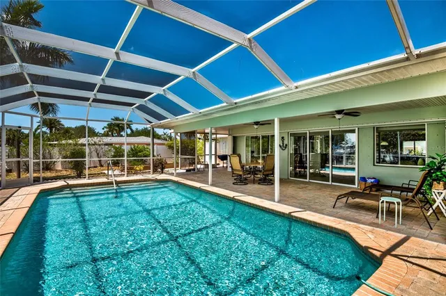 a view of a house with backyard porch and sitting area