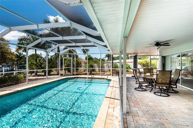 a view of a swimming pool with a patio